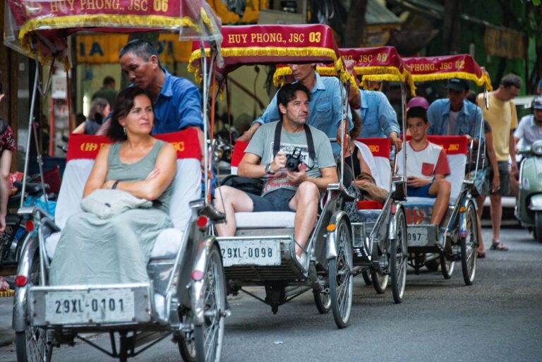 Indian tourists cyclo ride Hanoi Old Quarter